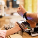 Person paying watch Apple Watch