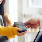 Customer using credit to tap and pay.